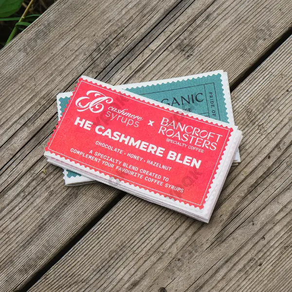 Stacked custom paper stickers for coffee branding and retail packaging