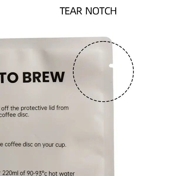 Tear notch and heat-sealed edge on flat drip coffee pouch
