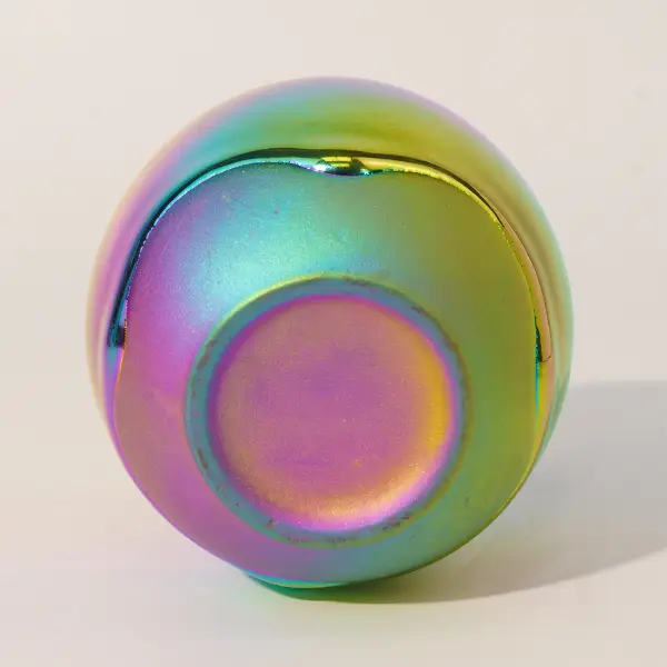 Holographic glaze detail on custom-shaped ceramic coffee cup base