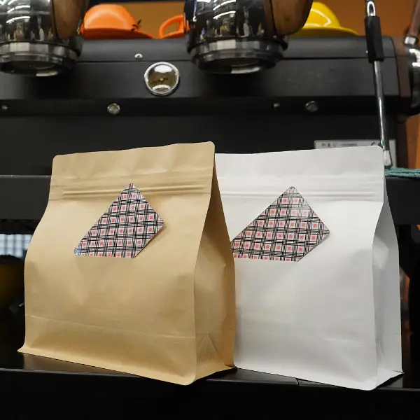 Horizontal coffee bags with card slit front view in kraft and white paper